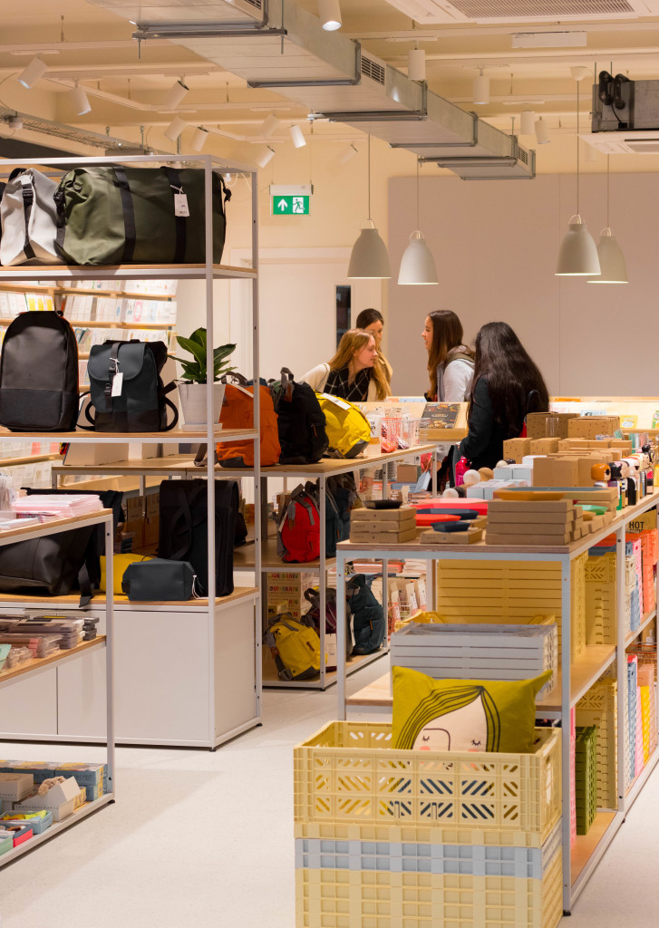 Above: The Manchester shop’s interior features bespoke plywood fittings and a uniform, pared down urban palette.