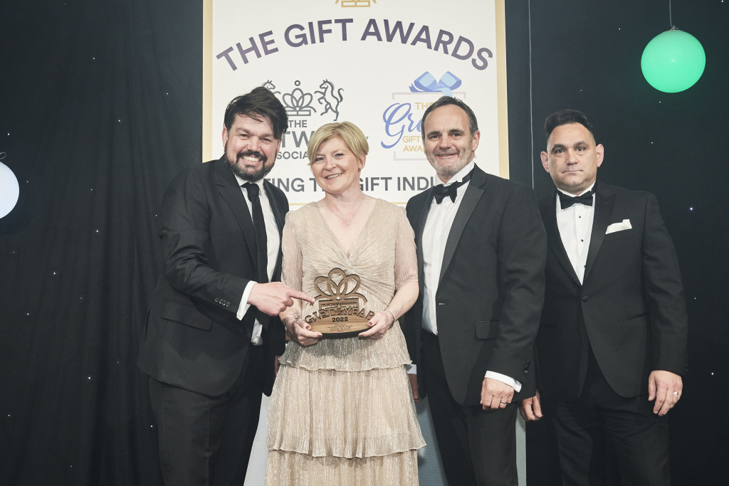 Above: Mike Antwoon, sales director of Yodel, category sponsor, presented Julian and Nikki Garner, co-owners of Inside Out Toys, with their GOTY trophy.