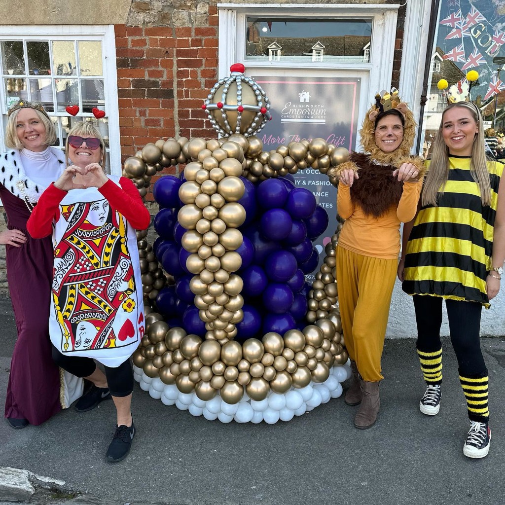 Above: Highworth Emporium’s owner Aga Marsden (left) is shown with her team, having created a balloon crown for the village’s May Day Coronation celebrations.