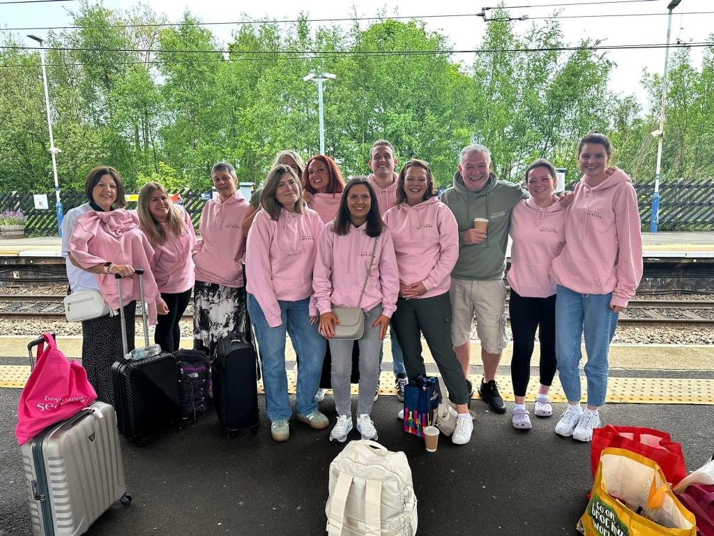 Above: Dressed for success! All 12 members of the Best Kept Secrets team leaving Morpeth for London wearing matching hoodies.