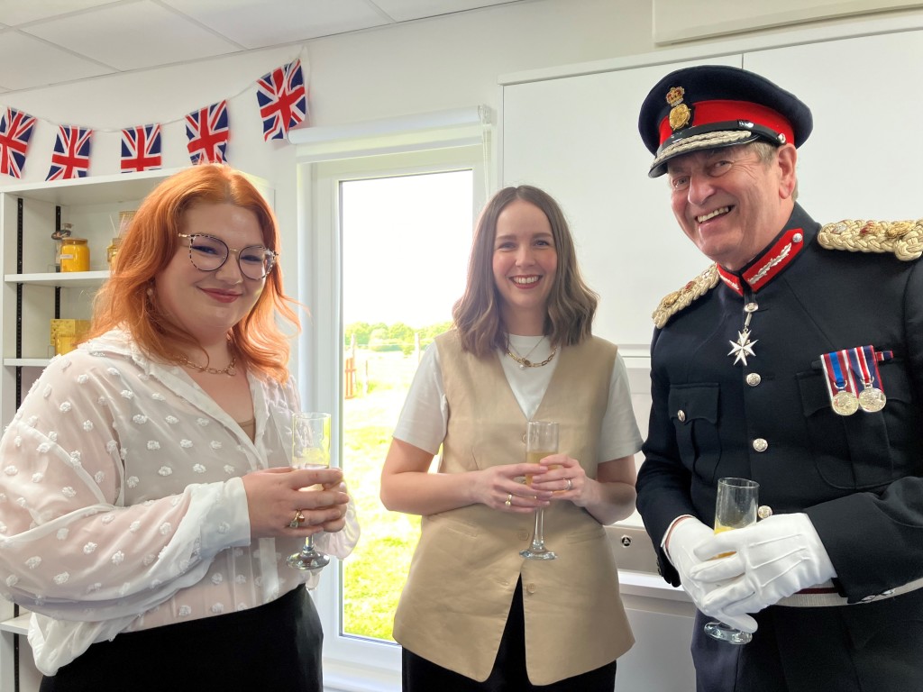 Above: Cheers! From left to right: Sebnini’s Amy Warburton, new product development manager, Lucy Carroll, head of procurement, and the Lord-Lieutenant of Surrey, Michael More-Molyneux.