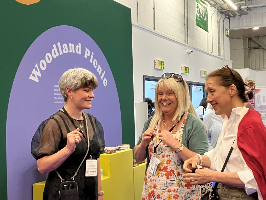 Above: Louise Healy, (left), co-founder of The Better Trends Company, is shown chatting to visitors in the Home & Gift trends area yesterday (21 July)