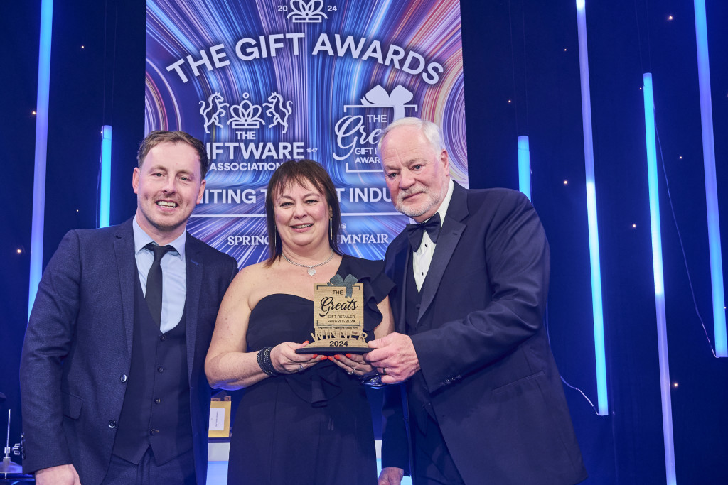 Above: The Greats Garden Centre Retailer of Gifts trophy was presented to Blue Diamond Group buyer Carla Ringer by Bob Harper (right) on behalf of Henry & Co, category sponsor. On the left is compere Andrew Ryan.