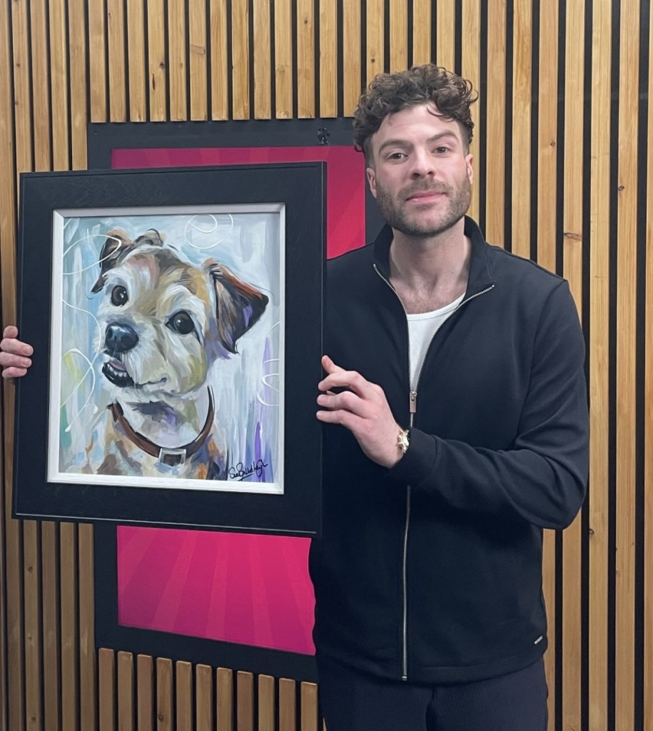 Above: DJ and TV presented Jordan North with Sue Ballard painting of his late dog Frank