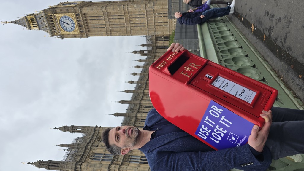 Above: Cardology’s David Falkner took a video of his journey from his office in Surrey to Parliament last week, carrying a 20kg pillar box. See link below.