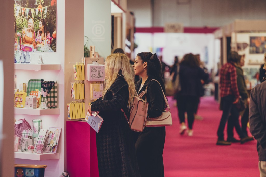 Above: A visitor shown holding her copy of The Little Black Book at a previous Spring Fair.